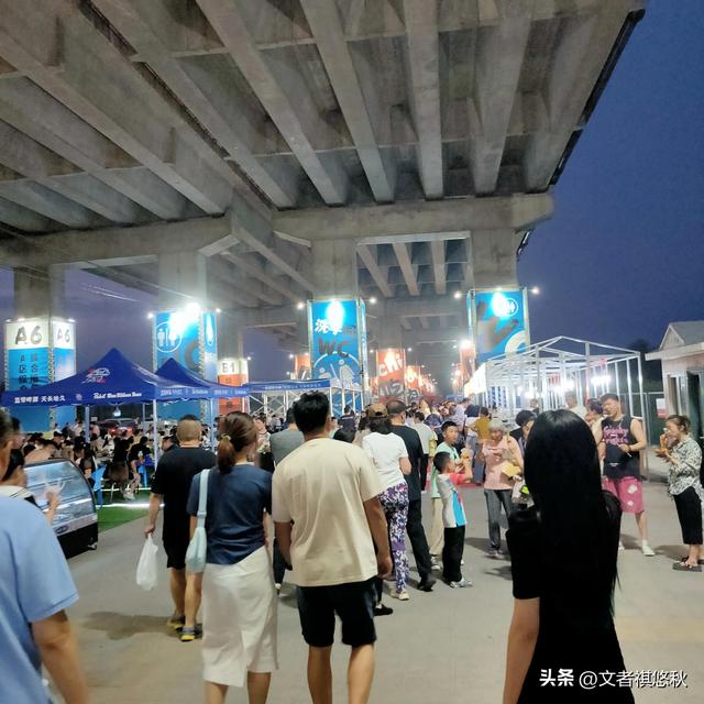 阳明滩大桥下的夜市：保安态度粗暴、停车困难、尾气扰人等瑕疵